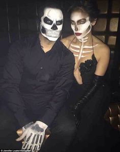 two people dressed up as skeletons for halloween