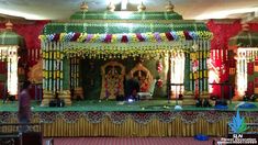 the stage is decorated with flowers and garlands