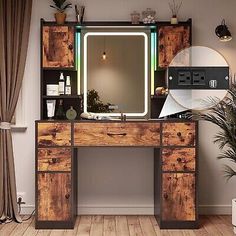 a wooden desk topped with a mirror and a potted plant