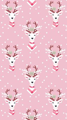 a pink wallpaper with deer heads and polka dotes on it's side