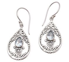 With their intricate patterns and dazzling blue topaz accents, these sterling silver dangle earrings instantly dress up any outfit. From Novica. Topaz Color, Silver Dangle Earrings, Sterling Silver Dangle Earrings, Jewelry Packaging, Artisan Craft, Hook Earrings, Jewelry Gift Box, Unique Earrings, Free Jewelry