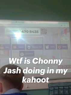 a young boy is looking at a large screen with the words wif is chony jash doing in my kahoot