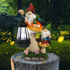 a garden gnome statue holding a lantern on top of a tree stump