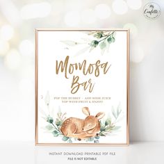 a baby shower sign with the words momosa bar in gold foil on top of it