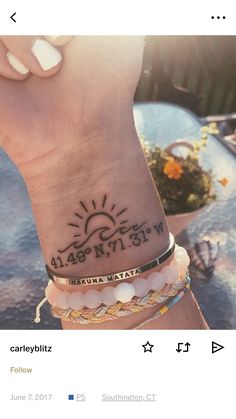 a person's wrist tattoo with the words happy new year written on it