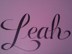 the word leap written in cursive black ink on a purple background with an arrow