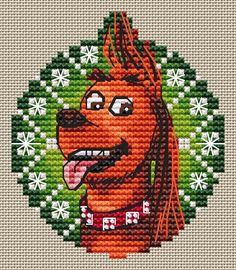 a cross stitch pattern of a dog with long hair and a wreath in the background