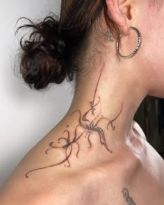 a woman with a tattoo on her neck