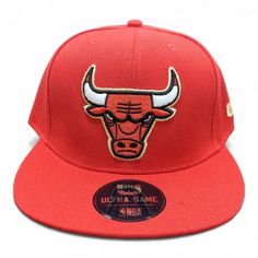 the chicago bulls hat is red and has an embroidered bulls logo on it