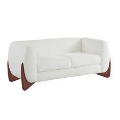 a white couch sitting on top of a wooden frame