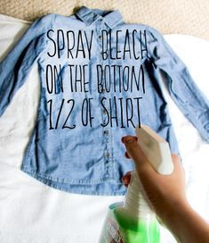 someone is using a spray bottle to disinfectate a denim jacket that says spray beach on the bottom