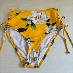 Cupshe Bathing Suit Bottom Super Cute To Wear To The Pool Or Beach. Nwt Has Hygienic Protection Still On. 2 Side Tie-Ups. Color: Yellow, White, Green Floral. Size: Xs Comes From Smoke/Animal Free Home. Fast Delivery. Yellow Floral Print Vacation Bottoms, Vacation Yellow Floral Print Bottoms, Fitted Mustard Bottoms For Beach, High Waist Yellow Bottoms For Poolside, Spring High-waist Yellow Swimwear, Yellow Stretch Swimwear For Spring, Yellow Printed Swimwear For Spring, Yellow High Waist Summer Swimwear, Spring Yellow Printed Swimwear