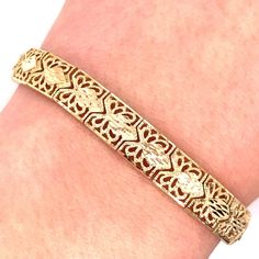 Vintage 14k yellow gold filigree link bracelet. The bracelet is 7" long and almost 8mm wide and features a lobster clasp. The bracelet weighs 14.03 grams of gold. Classic Gold Bracelet With Filigree Details, Classic Gold Filigree Bracelet, Classic 14k Gold Bracelet With Intricate Design, Gold Filigree Bracelet In 14k Gold, Formal 14k Gold Filigree Bracelets, 14k Gold Filigree Bracelets, 14k Gold Filigree Bracelet, Formal Yellow Gold Bracelet With Filigree, Formal 14k Gold Bracelet With Intricate Design