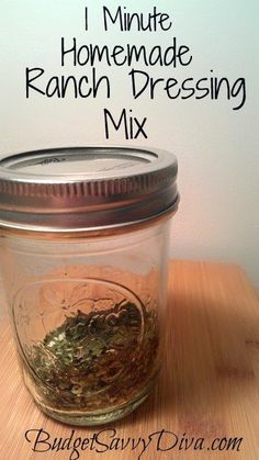 a jar filled with dirt sitting on top of a wooden table