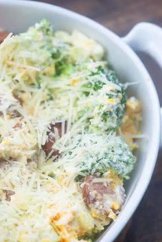 a casserole dish with broccoli, cheese and meats in it