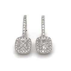 Perfect match, our 1.35ct tw diamond drop earrings are timeless and sure to please for everyday wear.Metal: 18K White GoldDiamond Shape: 2 Siganature Daussi Cushion Brilliant-cutsDiamond Weight & Details: 0.88ct tw - F color / VS2 ClarityPave Diamonds: 82 Round Brilliant Cuts 0.47ct twBackings: Lever Backs Certificate: Henri Daussi Cushion Cut With Halo, Henri Daussi, Diamond Drops, Diamond Drop Earrings, Cushion Cut, Brilliant Cut Diamond, Halo Diamond, Pave Diamonds, White Gold Diamonds