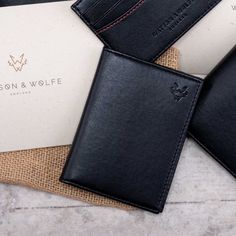 The bifold card holder in black features six card pockets with RFID protection. Each card wallet is handmade with a high-quality, lightweight alternative to leather. The material is made from non-food grade corn and contains more than 30% plant content. The corn is from a renewable source, and the final material is 3 x more environmentally friendly than animal leather. It is water, stain, and scratch resistant. Inside, the woven lining has been made using 100% recycled plastic bottles. It is soft and strong like polyester, but unlike virgin polyester, recycled PET fabric has a significantly lower impact on the environment. It uses 94% less water, 60% less energy, and 32% less CO2 to manufacture.  6 credit card pockets  folded notes and bills  RFID Protection Dimensions:  7.7cm (W) × 10.2cm Luxury Black Card Holder For Gift, Christmas For Him, Recycled Gifts, How To Fold Notes, Business Card Cases, Eco Gifts, Leather Card Wallet, Luxury Card, Christmas Gifts For Him