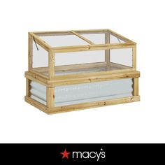 a wooden box with glass inside sitting on top of a white background and the words macy's written below it