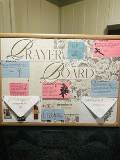 a bulletin board with post it notes and envelopes attached to the back of it