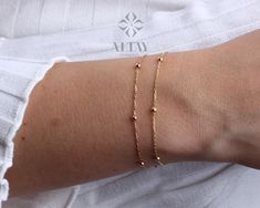 ABOUT PRODUCT  This 14K Gold Bead Chain Bracelet is suitable gift for girlfriend, mom and her. You can even buy as a birthday gift for your friends or anniversary gifts, If you want to add a special note we can write for you and put to inside of package. We manufacture our jewelry pieces with carefully and after production we double checking in quality control department. Our main idea is keep our items for daily wearing especially for minimalist jewelry pieces. 14K Gold Bead Chain Bracelet, Min Minimalist Beaded Bracelets With Ball Chain, Minimalist Ball Chain Bracelet As Gift, Minimalist Ball Chain Bracelets For Everyday, Minimalist Beaded Bracelets With Satellite Chain For Gift, Minimalist Ball Chain Bracelets As Gift, Minimalist Ball Chain Bracelet Gift, Minimalist Everyday Ball Chain Bracelets, Everyday Minimalist Ball Chain Bracelet, Minimalist Everyday Ball Chain Bracelet