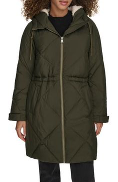 Staying warm will become effortless in this diamond-quilted parka that's water resistant and lined with cozy fleece at the hood. A drawcord-toggle waist lets you adjust the silhouette if you prefer a more snug fit. Front zip closure Drawstring hood Front welt pockets Adjustable snap cuffs Drawcord-toggle waist Water resistant Lined, with 100% polyester fill 100% polyester Machine wash, tumble dry Imported Long Parka Jacket, Womens Sherpa, Quilted Parka, Puffer Parka, Coat With Hood, Long Parka, Quilted Puffer Jacket, Levis Jacket, Hooded Parka