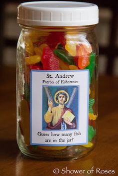 a jar filled with gummy bears sitting on top of a wooden table