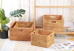 three wicker baskets sitting next to each other on a rug in front of a window