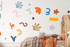 a child's bedroom with colorful wall decals