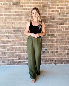 Slip into something comfy with these stylish Making Moves Wide Leg Pants! The olive green hue is perfect for any season, and the wide leg design lets you make one heck of a statement. Plus, you'll stay breezy and relaxed no matter where you go. High rise Wide leg Elastic waist Side pockets Partially Lined Inseam: 28" measured on a medium Fit: Small 3-5, Medium 7-9, Large 11-13 Body: 64% rayon, 36% polyester Lining: 100% polyester Sage Linen Pants Outfit, Olive Green Linen Pants Outfit, Green Flowy Pants Outfit, Olive Wide Leg Pants Outfit, Green Pants Outfit Summer, Green Linen Pants Outfit, Green Wide Leg Pants Outfit, Campus Fits, Olive Green Pants Outfit