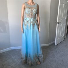 2 Available. Size 4 Tulle Light Blue With Gold Lining Dress New Without Tag Blue Summer Party Gown, Blue Floor-length Summer Evening Dress, Floor-length Blue Dresses For Spring, Sleeveless Light Blue Party Gown, Blue Maxi Length Prom Dress, Blue Maxi Dress For Prom Season, Blue Sleeveless Prom Dress, Fitted Sleeveless Light Blue Gown, Light Blue Sleeveless Dress For Prom