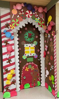 the door is decorated with candy land and gingerbreads on it's sides