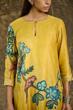 Haldi yellow kurta with hand painted floral and peacock motifs and placed sequins hand embroidery. Paired with a teal blue pant with sequins embroidered scalloped hem. - Aza Fashions Yellow Kalamkari Print Kurta For Diwali, Yellow Kalamkari Kurta For Diwali, Unstitched Yellow Kurta With Block Print, Spring Yellow Tops With Printed Motifs, Yellow Floral Print Kurta For Diwali, Unstitched Yellow Sets With Kalamkari Print, Festive Yellow Tops With Printed Motifs, Traditional Yellow Tops With Printed Motifs, Unstitched Yellow Kalamkari Print Sets