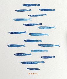 several blue fish floating in the air on top of a white paper with writing underneath it