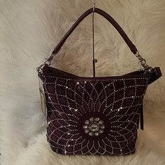 Sparkling Rhinestones Create A Sunburst Motif Full Of Polish And Sophistication On This Luxurious Faux Leather Hobo Bag. Has Back Zipper Pocket Single Strap 10 Inch Drop Length Detachable Strap With A 22 Inch Drop Length Both Straps Are Detachable Made Of Faux Leather Construction Fully Lined Interior Two Interior Slip Pockets And Two Zipper Pockets Top Zippered Closure Silver Hardware. Bags Purple, Coral Maxi Dresses, Slouch Bags, Suede Purse, Hobo Style, Fringe Bags, Brown Purses, Purple Rhinestone, Suede Fringe