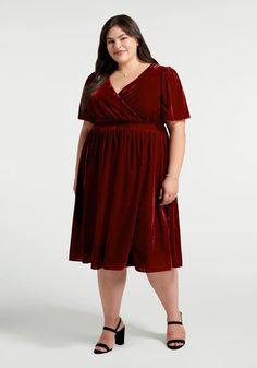 In a rich, beetroot red hue, this fluttery and flow-y velvet midi dress makes crossing the room look like a beautiful dance. Made from a stretchy velvet fabric with a gorgeous sheen and a plush texture, this effortlessly elegant midi dress boasts short flutter sleeves, a surplice neckline, and a gathered high-rise waistline that gives way to a drapey and dreamy A-line skirt. 75% Rayon, 25% NylonFabric provides stretchElastic panel at back waist provides stretchElevated pull-on styleFits true-to-sizeImportedModel Measurements: HEIGHT: 5' 9½''BUST: 32''WAIST: 26''HIPS: 38'DRESS: XS/2US Plus Model Measurements: HEIGHT: 5'9"BUST: 49"WAIST: 40½"HIPS: 50½"DRESS:14-16 Beautiful Dance, Elegant Midi Dress, Fashion 70s, 70s Outfits, Valentines Day Dresses, Elegant Midi Dresses, Velvet Midi Dress, Eve Dresses, New Years Eve Dresses