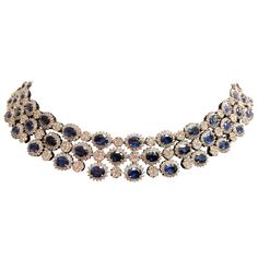 This one of a kind necklace features an astonishing 78 blue oval sapphires (for a total of 70.07 carats) , each with a white diamond halo and separated by a circle pave diamond design. This necklace is secured with a hidden clasp and safety lock, and is set in 18k white gold. Total diamond weight = 25.42 carats. Please contact us for more information. David Morris, Black Diamond Necklace, Gold Link Necklace, Blue Sapphire Necklace, Chalcedony Stone, Diamond Cocktail Rings, White Gold Necklaces, Sapphire Necklace, Elegant Necklaces