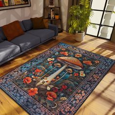 a living room with a blue couch and large rug on the floor next to it