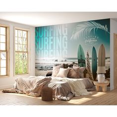 a bedroom with a surfboard mural on the wall