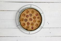 a cake in a pan on top of a white table