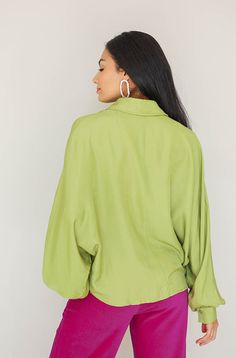 Product Fit + Details: Long Sleeves Dollman puff sleeves Lime Green Functioning buttons Shirt collar Boxy, oversized fit Soft, silky material Not sheer Also available in Cocoa Brown Model is 5’6” wearing a size S Size Bust Length S 48" 23" M 50" 24" L 52" 25" Outfit Details: Catalog Magenta Corduroy Pants Fabric + Care Instructions: 42% Polyester, 58% Rayon Hand wash in cold water Do not bleach Line dry Solid Color Lantern Sleeve Shirt For Fall, Solid Color Lantern Sleeve Fall Shirt, Fall Lantern Sleeve Solid Color Shirt, Fall Lantern Sleeve Shirt, Chic Green Top With Gathered Sleeves, Chic Green Tops With Gathered Sleeves, Green Batwing Sleeve Blouse, Spring Green Batwing Sleeve Blouse, Green Batwing Sleeve Blouse For Spring