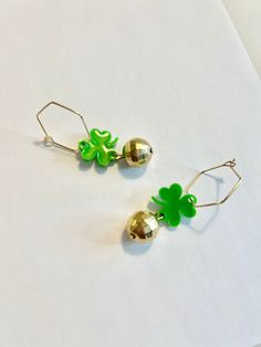 Get in on St Patrick's day festivities with these little numbers. Awesome gold disco ball charms with green clovers / shamrocks, complete with unique gold plated hoops (hypoallergenic). Super lightweight dangle earrings with an awesome rainbow / prism effect in shifting light.  These handmade statement earrings are perfect for St Patrick's Day! Only one exists - nobody else has anything like it- so if you're looking for an authentic, one-of-a-kind gift for a friend or yourself, look no further! St Patricks Day Jewelry, Gold Disco Ball, St. Patrick’s Day, Shamrock Earrings, Rainbow Prism, St. Patricks Day, Clover Green, Saint Patrick, Etsy Earrings Dangle