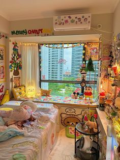 a child's bedroom with lots of toys and decorations on the walls, along with a large window