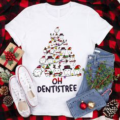 a white shirt with the words oh dentist tree on it next to some christmas decorations