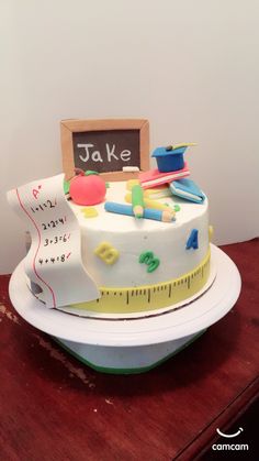 there is a cake that has been decorated with school supplies on the top and bottom