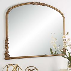 Perfect over a mantel, this Baroque style mirror features scroll embellishments at key focal points. This beautiful frame is finished in an antique gold that complements the ornate details. It is sure to be the center of attention at family gatherings. Also available in satin black, W00574.FeaturesDue to lighting and monitor differences, actual colors and finishes may vary slightly from what appears online. | Uttermost Wall Mirror in Gold | Wood | Nebraska Furniture Mart Gold Mirror Entryway, Mirror Above Buffet, Mirror Entryway Table, Refracting Light, Arch Wall Mirror, Antique Gold Mirror, Wood Arch, Gold Baroque, At Family