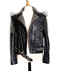 Handmade Women's Black Color Silver Studded Leather Jacket With Long Spikes Material: Genuine Leather Inner: Soft Smooth Lining Design Details: Classic Studded Color: Black Closure: Front Zippered Closure Sleeves: Long Sleeves Pockets: Front Zippered Pockets  & Waist Studded Belt    Construction : Handmade Stitched  Shipping : Fedex Express Shipping 4 to 6 Days For USA, CANADA   Handling Time 10 working Days Jaket Motor, Rock Punk Style, Gothic Jackets, Studded Leather Jacket, Mens Fashion Edgy, Studded Jacket, Biker Leather, Dark Wear, Genuine Leather Jackets