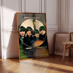 the beatles for sale poster in front of a chair