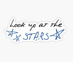 sticker with the words look up at the stars written in blue ink on a white background