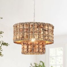 a chandelier hanging from the ceiling in a living room