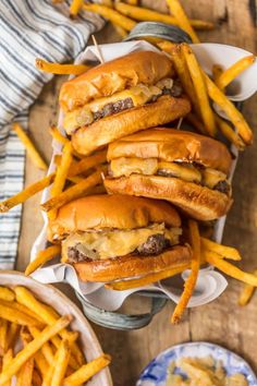 cheeseburger and french fries on a wooden table